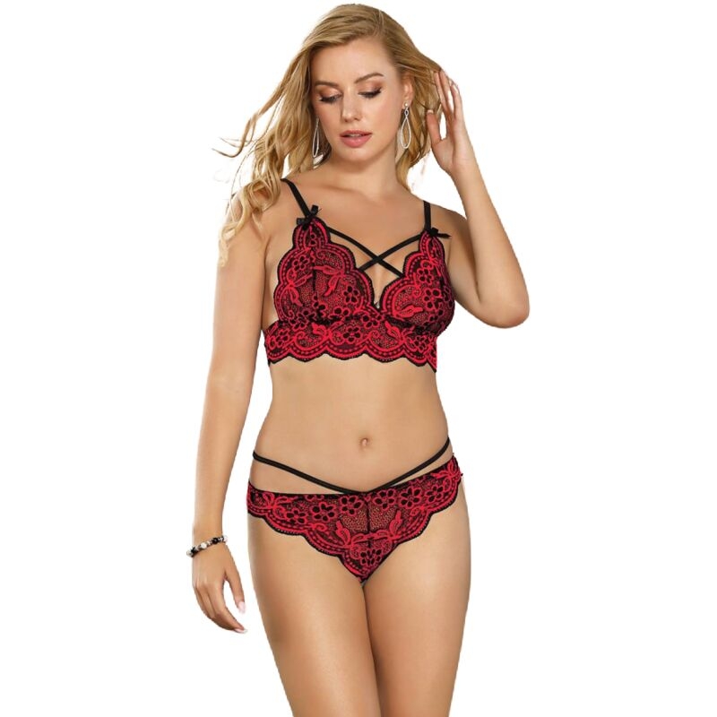 Model wearing a red and black lace lingerie set (bralette and matching panties) with decorative strap details.