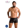 Male model wearing black leather shorts with side zippers on a white background; European-made badge visible in corner.