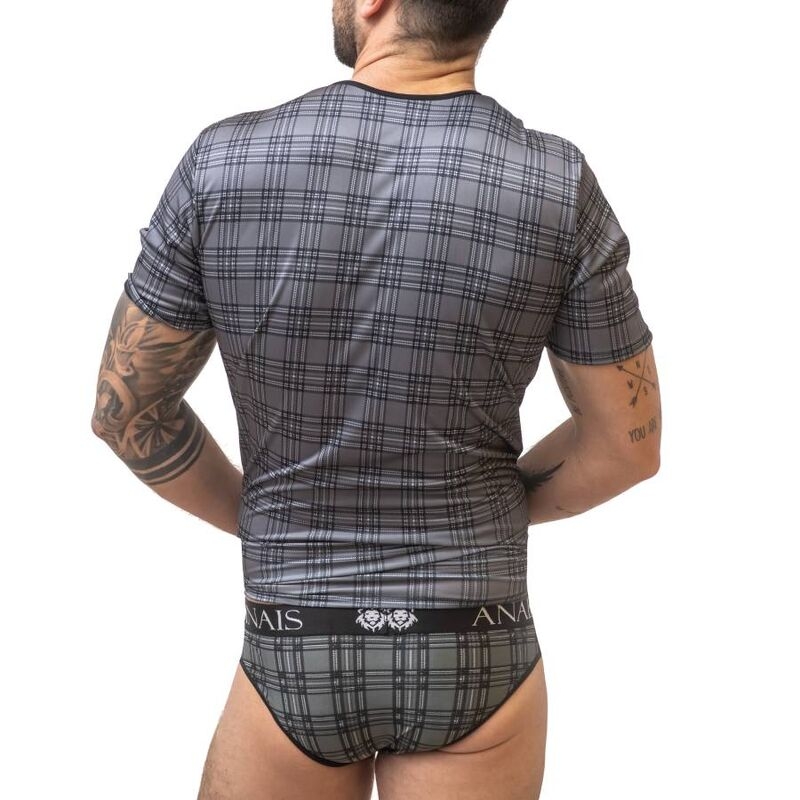 Man standing with his back to the camera, wearing a gray plaid short-sleeve shirt and matching gray plaid briefs; visible tattoos on both arms.