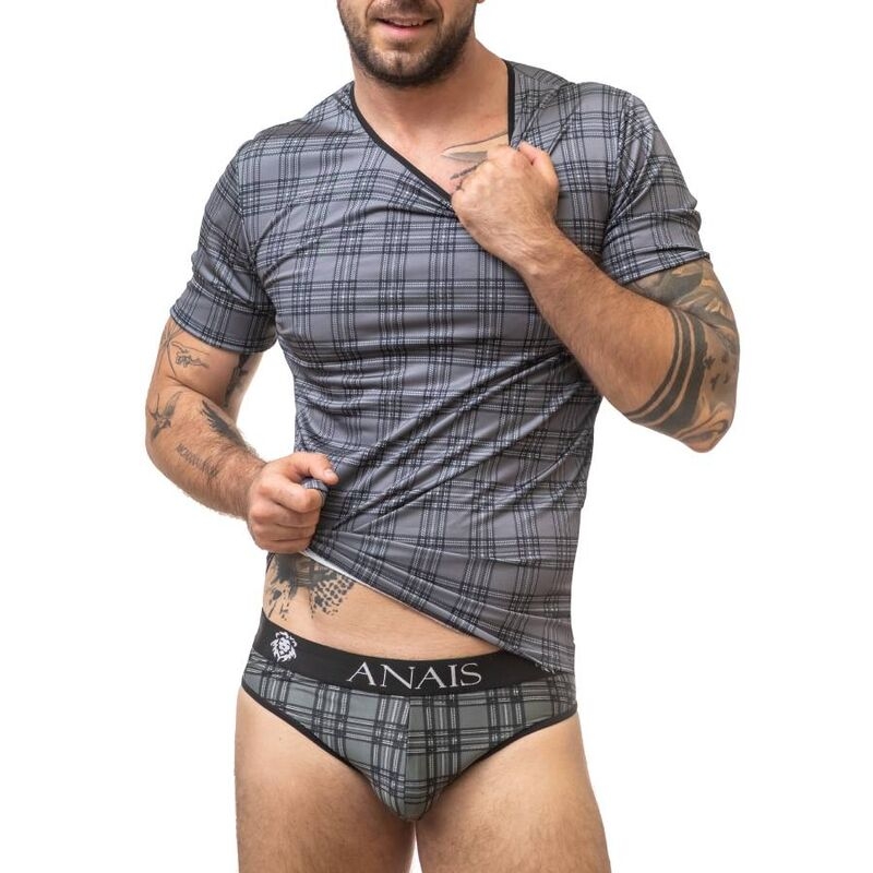 Man in a gray plaid T-shirt lifting it to show gray plaid briefs with a black ANAIS waistband.
