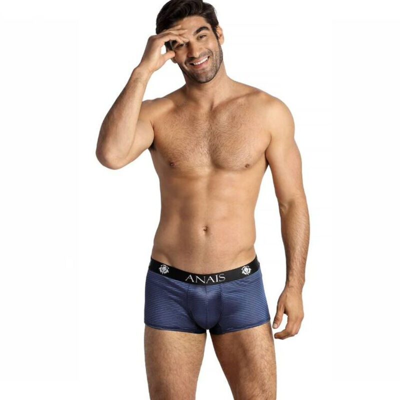 Man wearing navy blue ANAIS boxer briefs with a black waistband, posing with hand to head against a white background.