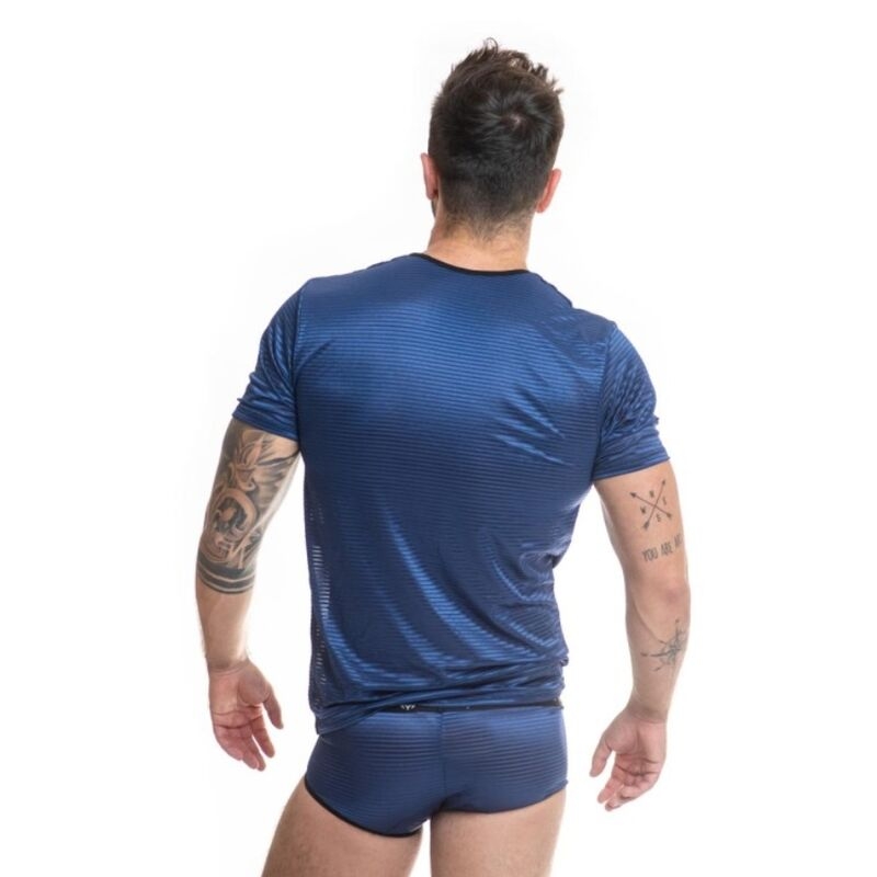 Man shown from behind in a blue athletic shirt and matching briefs, with tattoos on both arms visible from the back.