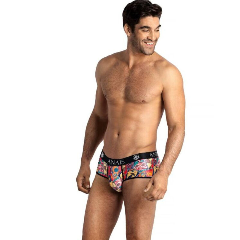 Male model wearing colorful patterned men's briefs with a black waistband that reads ANAIS, standing and smiling.