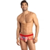Smiling man standing in colorful patterned briefs with a red waistband.