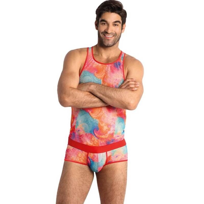 Man modeling a colorful tie-dye tank top and matching red-trimmed briefs, arms crossed, smiling.
