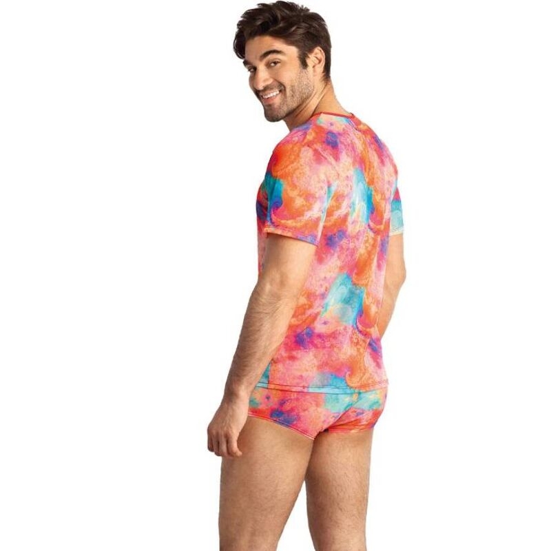 Man modeling a bright tie-dye short-sleeve shirt with matching shorts, turned to the side and smiling on a white background.