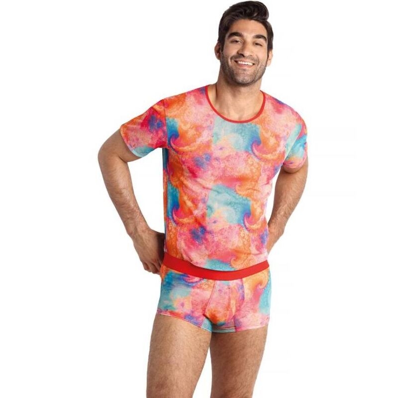 Smiling man modeling a vibrant tie-dye T-shirt and matching shorts set with a red waistband.