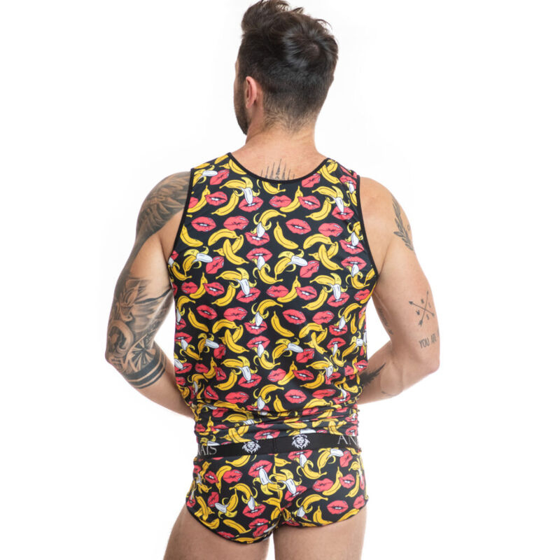 Man with tattoos wearing banana-print tank top and brief set, shown from behind.