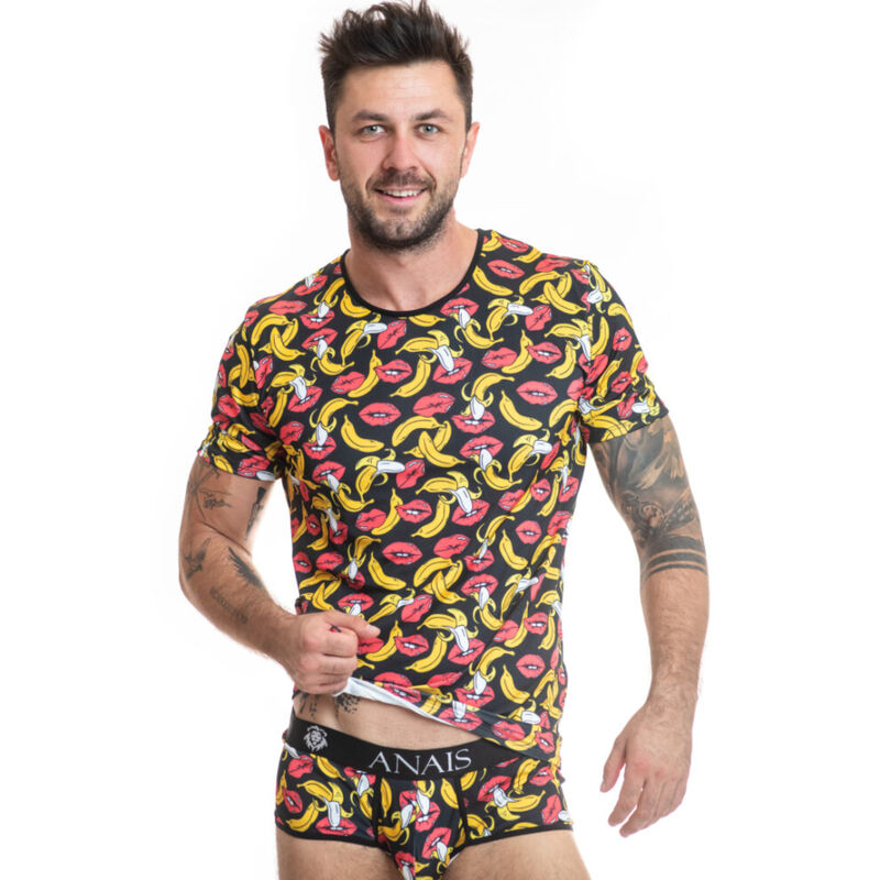 Man wearing a black shirt with a colorful bananas and lips print and matching branded underwear (Anais).