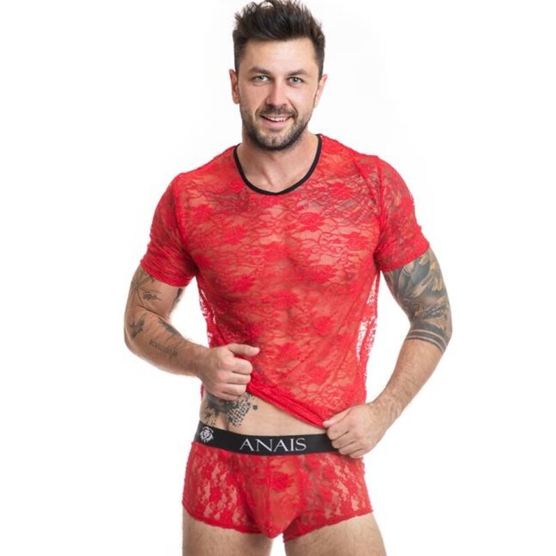 Man modeling a red lace sheer shirt and matching briefs, smiling at the camera with hands on the waistband (brand ANAIS).