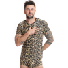 Man in leopard-print matching T-shirt and shorts posing with hand on chest against a white background, tattoos visible on arms.