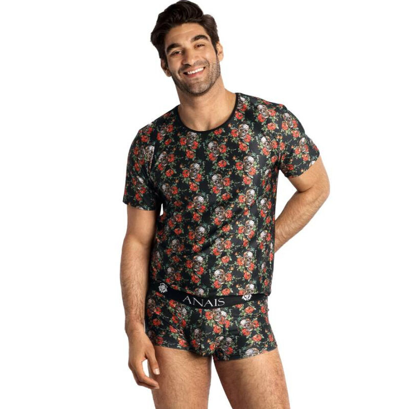 Smiling man modeling a black floral print short-sleeve tee and matching boxer shorts with ANAIS waistband.