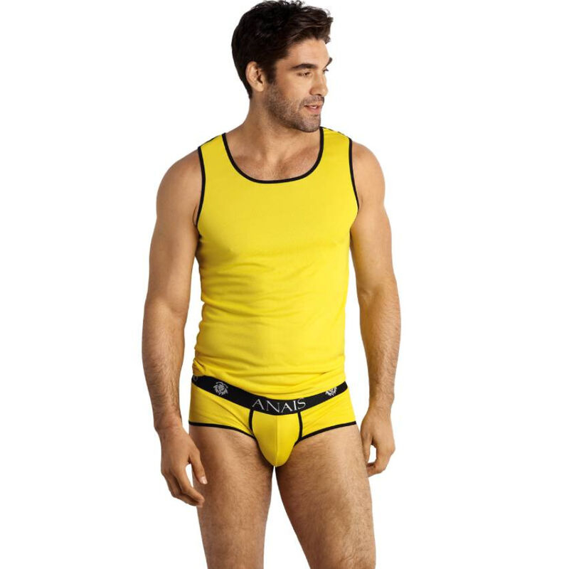 Man wearing a yellow tank top and matching yellow briefs with black trim, looking to his left.