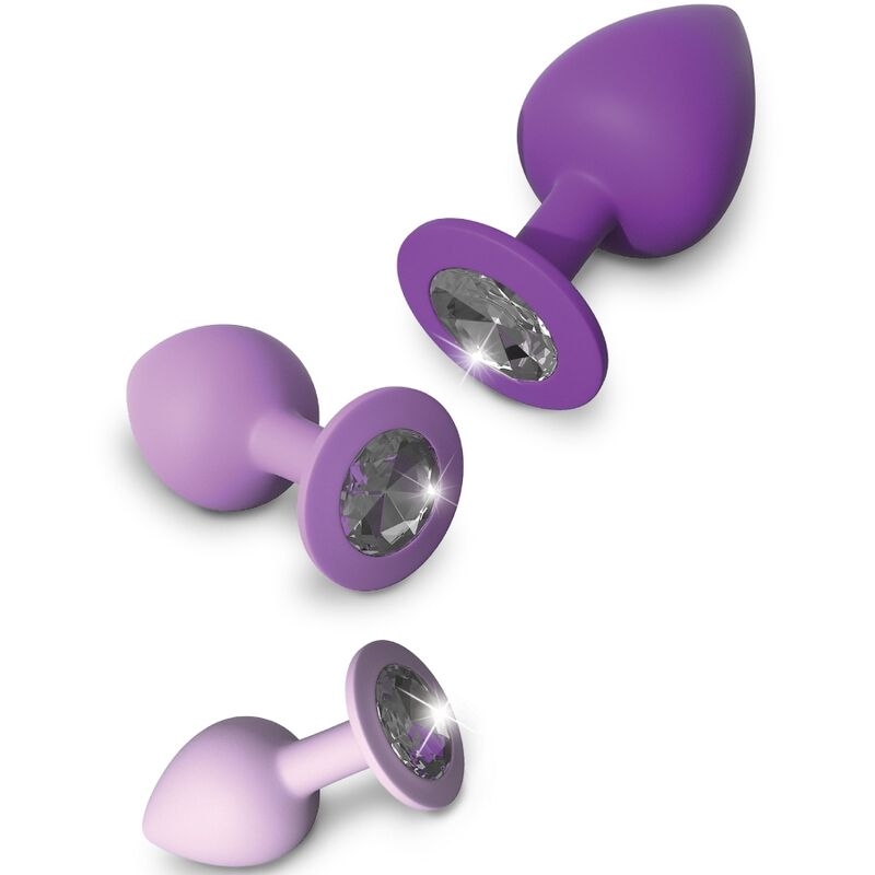 Set of three purple silicone anal plugs in varying sizes, each with a jewel-like crystal base for decorative contrast.