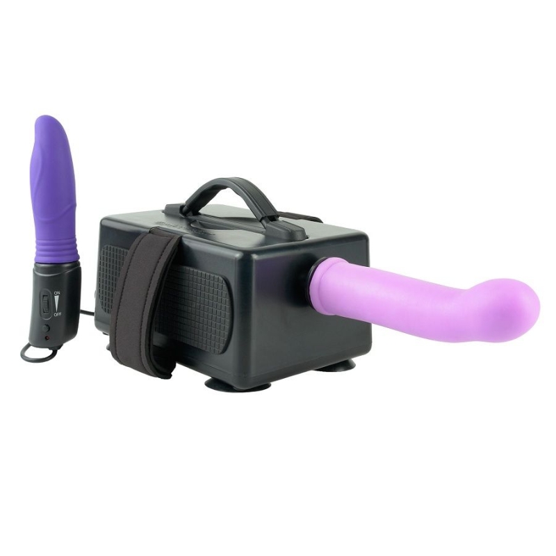 Purple dildo vibrator connected to a handheld remote, placed on a black storage/charging box with a strap.