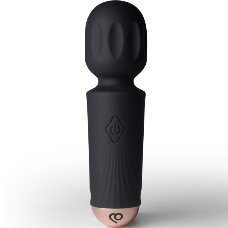 Black silicone vibrator with rounded head and power button on the shaft, standing upright on a white surface.