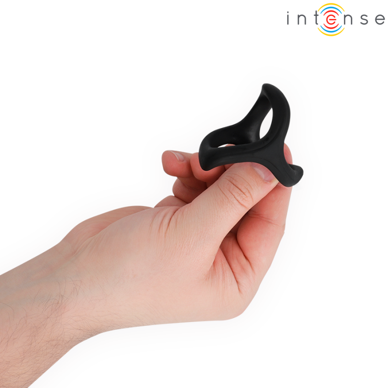 Close-up of a hand holding a small black silicone ring (sex toy) against a white background, with the Intense logo in the corner.