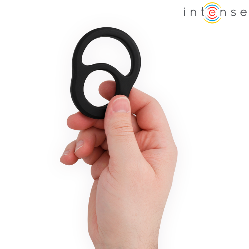 Hand holding a black silicone double-loop penis ring, brand Intense logo in the corner.