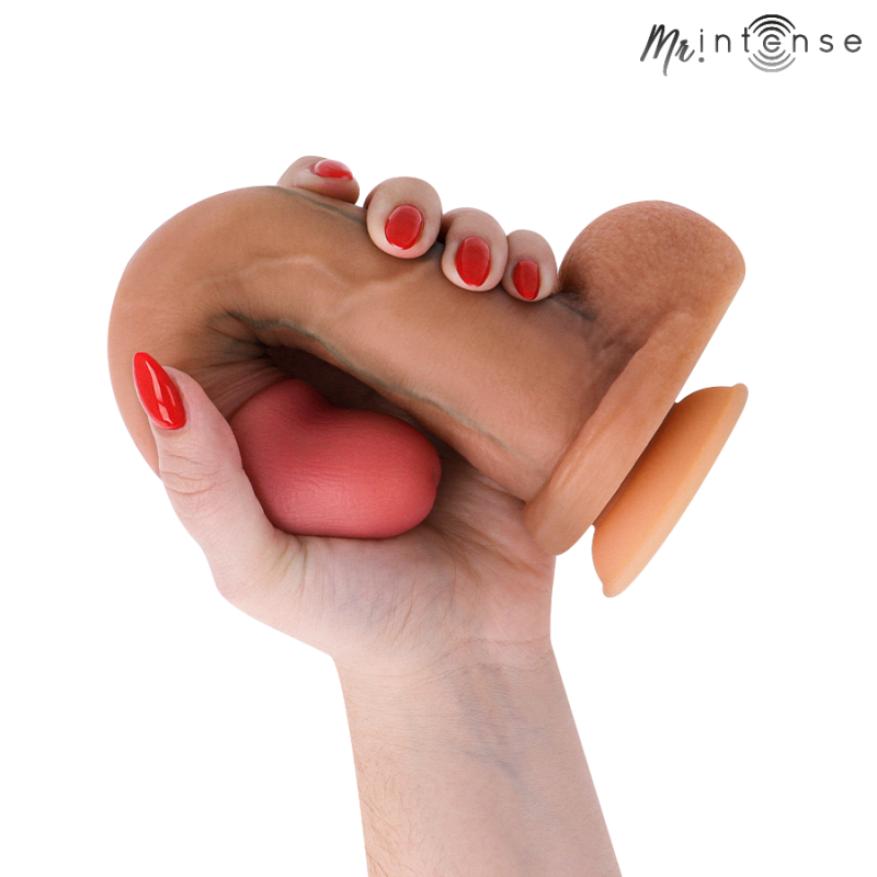 img_221633_80442cbf26cc308c185b030d195e1e36_1png - Sex Shop | Lodia.gr - 100% Διακριτική Και Παράδοση με courier της επιλογή σας Hand gripping a life-size silicone dildo with an orange suction base; Mr. Intense logo in the corner.