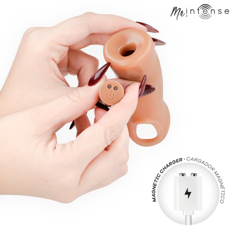 img_221713_516fe8c997a527ff41a386d398c99262_1png - Sex Shop | Lodia.gr - 100% Διακριτική Και Παράδοση με courier της επιλογή σας Close-up of hands attaching a small control button to a silicone anal plug, with a magnetic charger icon in the corner.