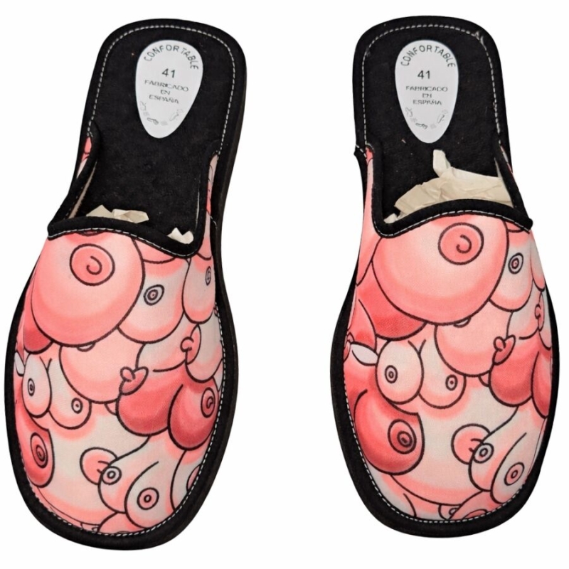 Pair of pink slip-on slippers with a bubbly abstract pattern and black trim, size 41.