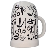 White ceramic mug viewed from the side, covered in bold black abstract doodle shapes around the surface.
