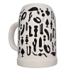 White ceramic beer stein covered in black silhouettes of various sex-toy shapes.