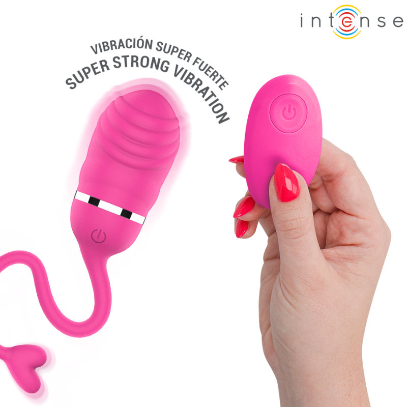 img_223842_5fbc66a14423e1c6cd428ac743f30c1b_1png - Sex Shop | Lodia.gr - 100% Διακριτική Και Παράδοση με courier της επιλογή σας Pink wireless vibrator with a curved string leading to a small remote being held by a hand; curved text reads 'SUPER STRONG VIBRATION' with branding in the corner.