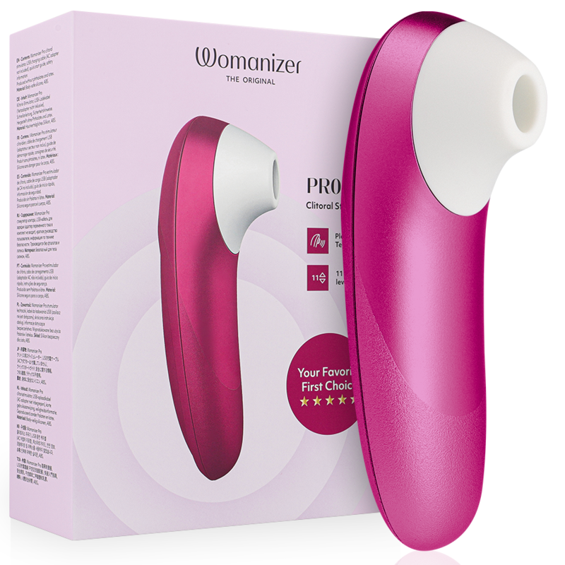 Pink Womanizer clitoral stimulator with white tip beside its pink packaging box, product shot for sexual wellness.