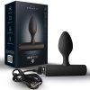 Rechargeable black silicone butt plug with a curved ergonomic bulb and flared base, shown with its dark retail box and USB charger.