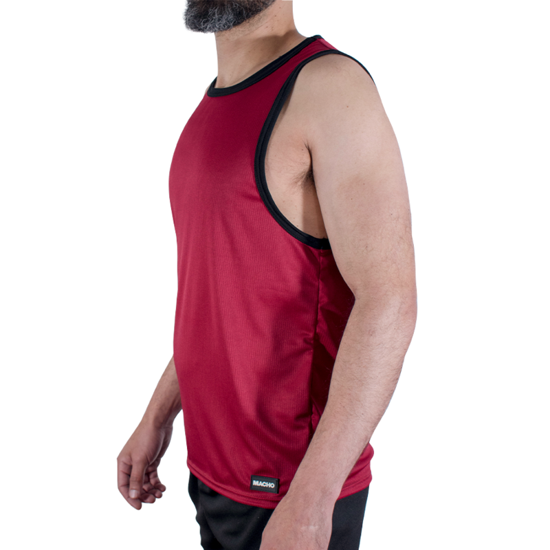 Side view of a man wearing a red sleeveless athletic tank top with black trim.