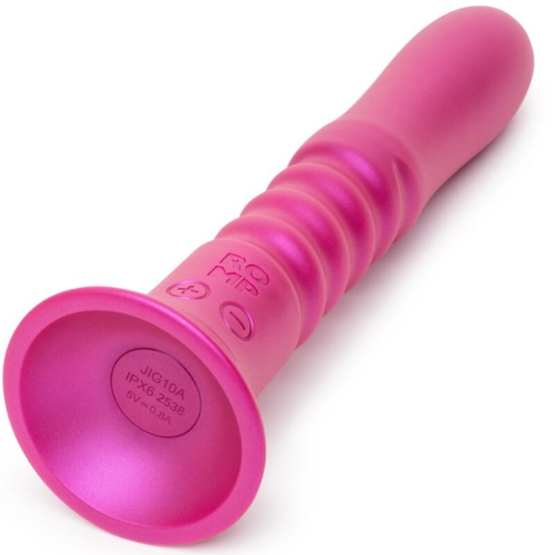 Pink silicone vibrator with a ribbed shaft and flared base, shown from an angled side view.