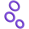 Three purple rubber O-rings of varying sizes arranged diagonally on a white background.