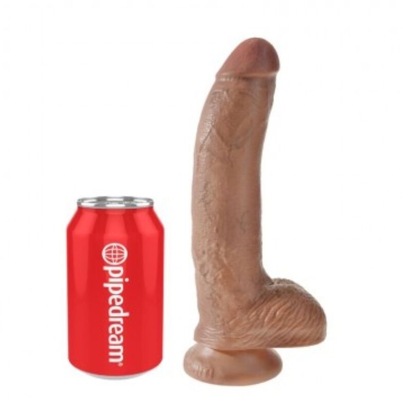 Brown dildo standing upright next to a red can for scale (adult sex toy).