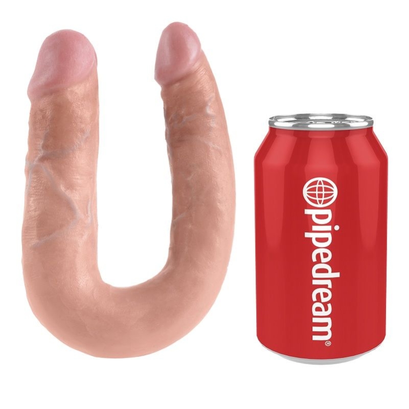 Pink curved dildo next to a red Pipedream can, showing a sex toy and branding.