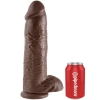 Large brown dildo standing upright beside a red soda can for scale.