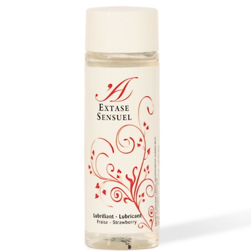 Clear plastic bottle of Extase Sensuel lubricant with a white cap and red decorative swirls; label reads 'Fraise · Strawberry'.