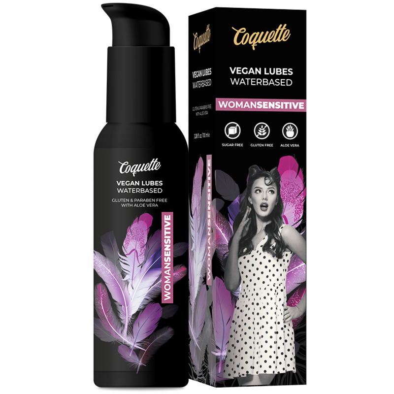 Black Coquette vegan water-based lubricant bottle with pink feather graphics, shown next to its black packaging box featuring a retro photo of a woman and a pink 'WOMAN SENSITIVE' label.
